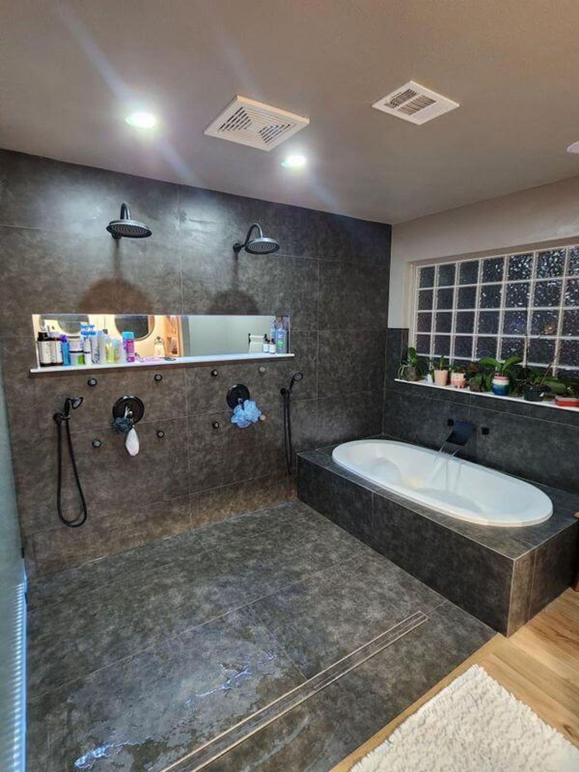 custom bathroom with shower and bathtub